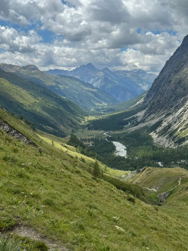 Waymarked trail winding along a steep valley side